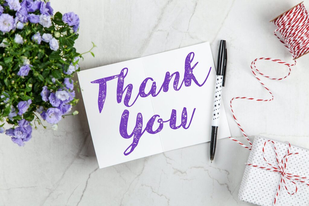 Hand written thanking note on a white paper