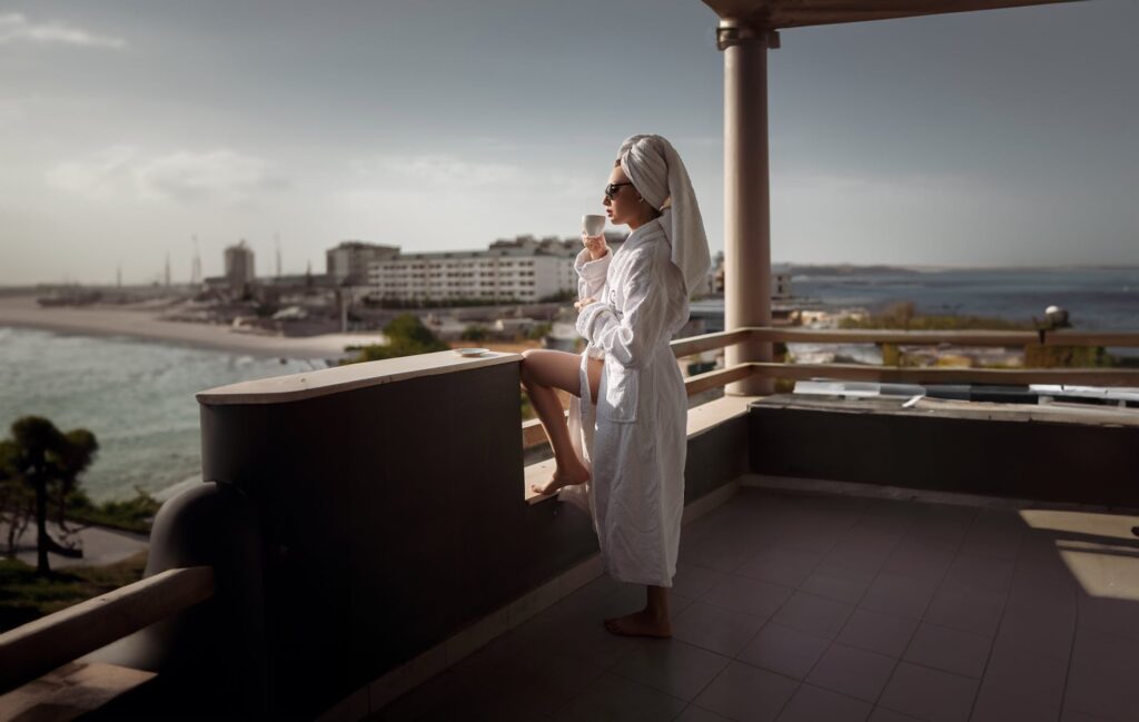A lady having a coffee wearing a bathrobe