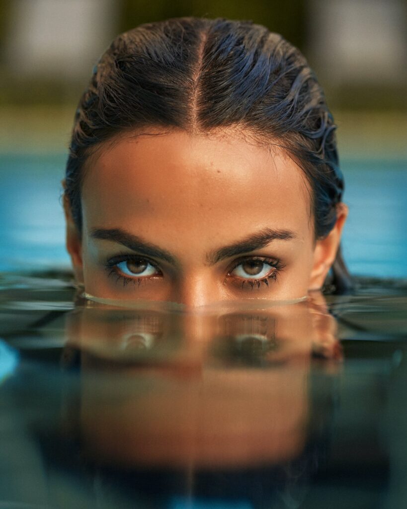 A lady in a pool closeup 