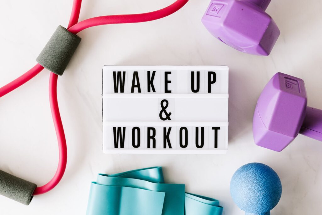 Wake up and workout title on light box surface: Workout Motivation Through Funny Inspirational Quotes

