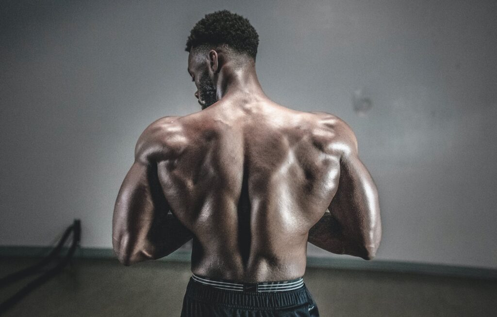 A Black Man Flexing Muscle
