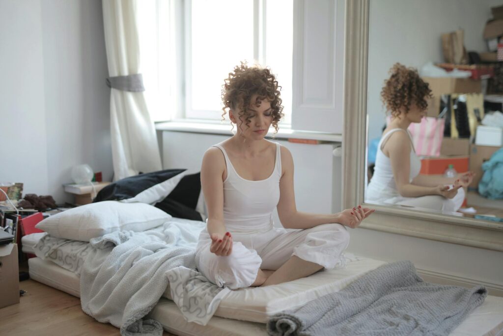 A lady practicing meditation, one of the best micro-habits for self-growth