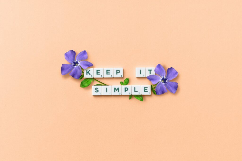 Text and Purple Flowers on Pastel Background