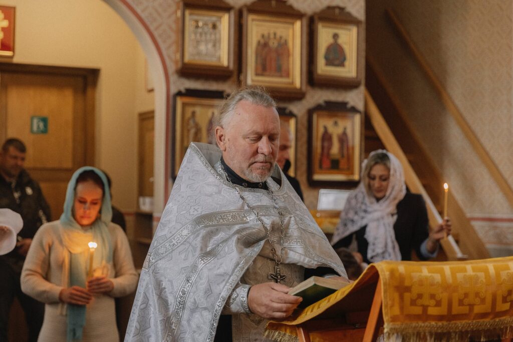 A Priest praying in orthodox church
