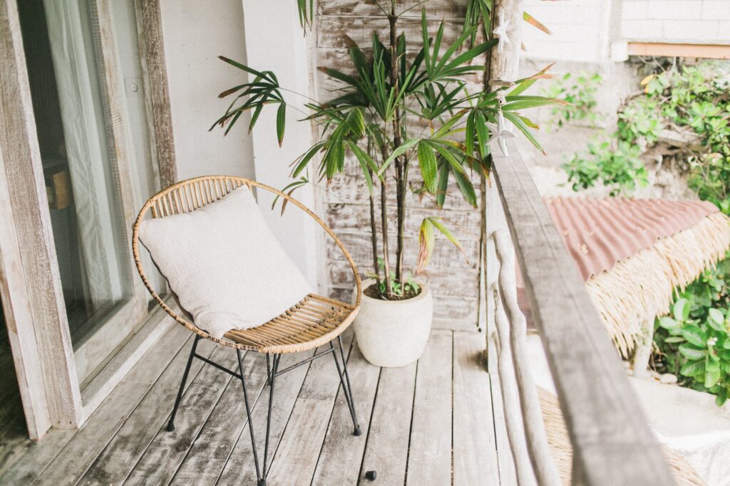Wooden chair and a indoor plant in the balcony