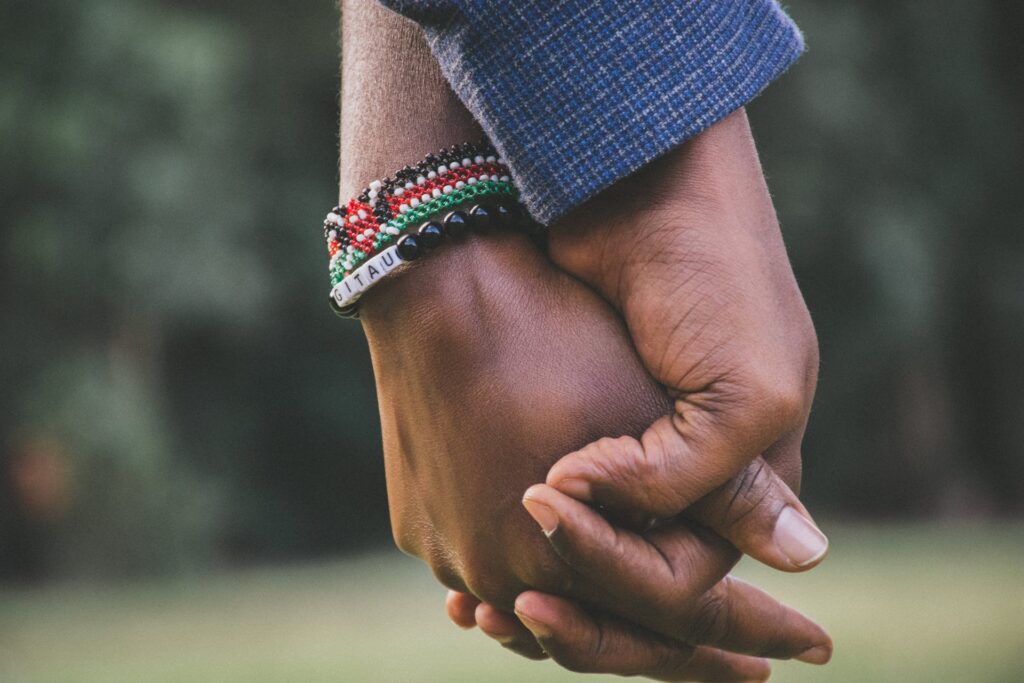 A closeup picture of a couple holding hands 