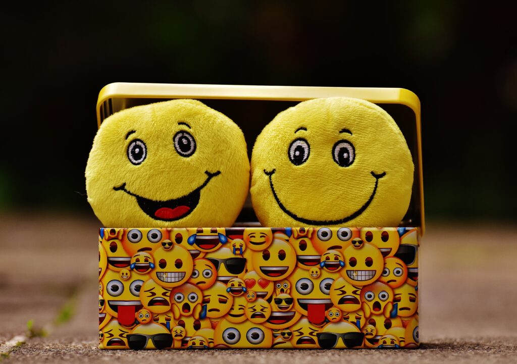 Two emojis on a yellow emoji box