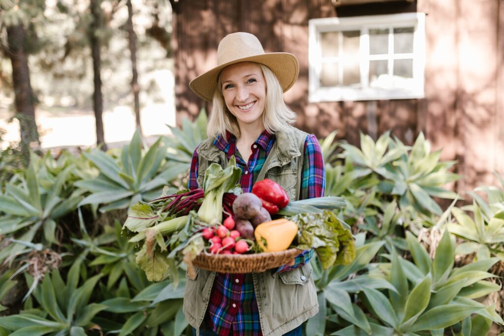 A lady having a true organic all-purpose plant food tray on her hands