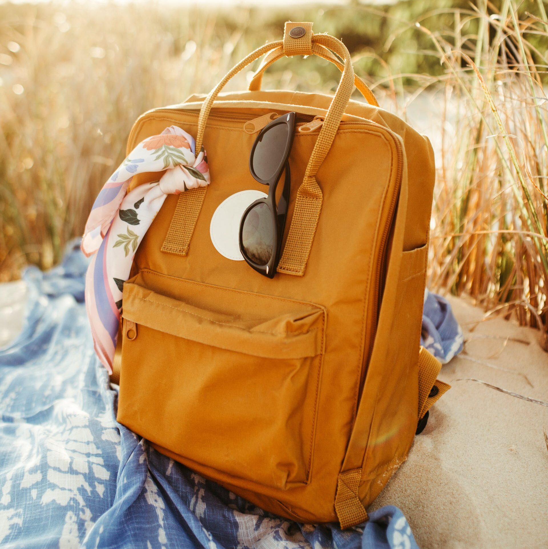 A brown backpack on a beach