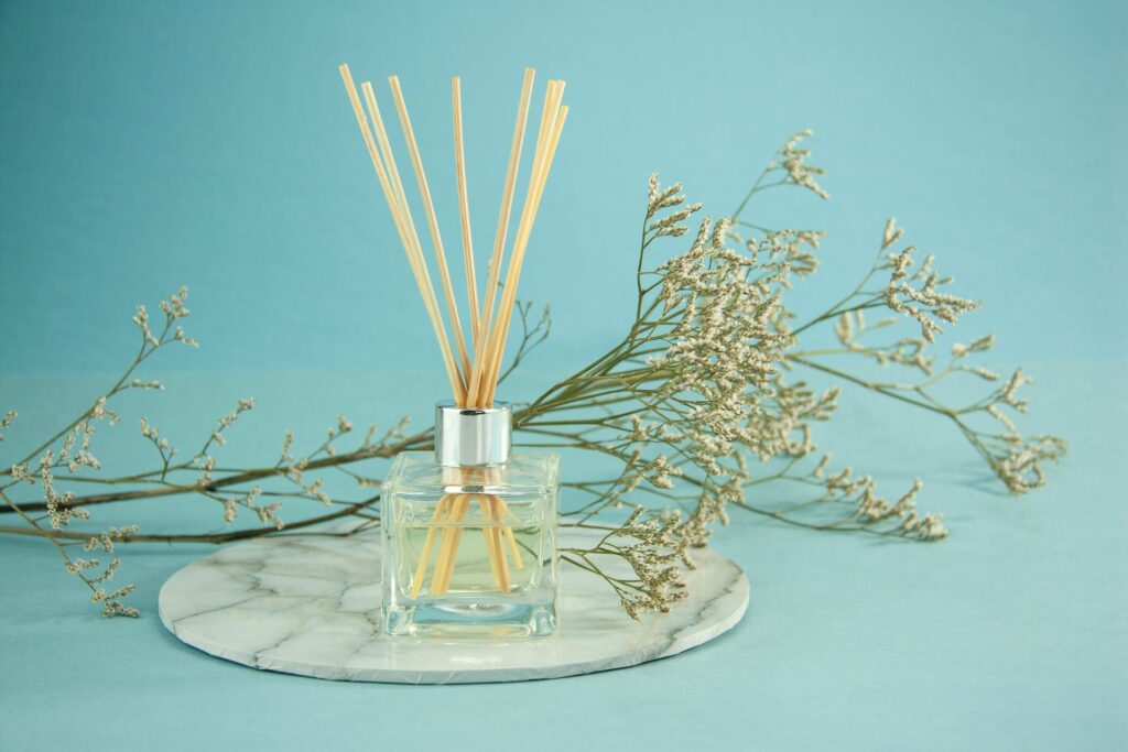 Essential oil filled glass bottle with sticks