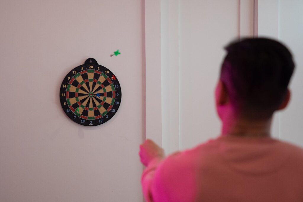 A man playing darts 
