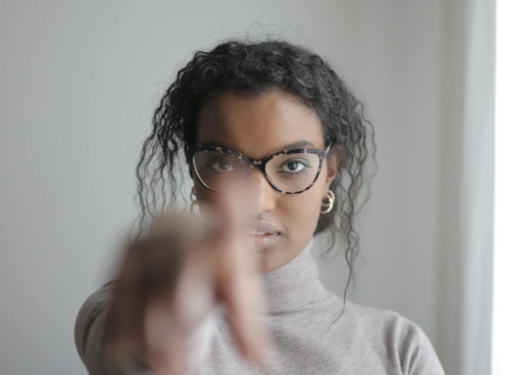 A woman pointing her finger to the camera