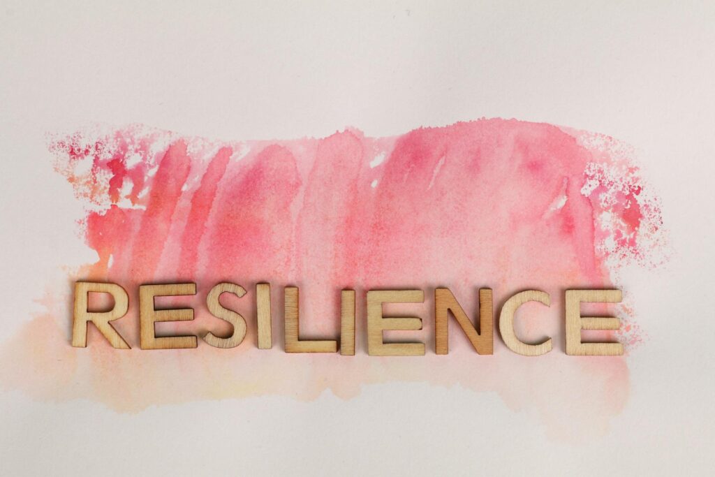 The word "RESILIENCE" on pink ink