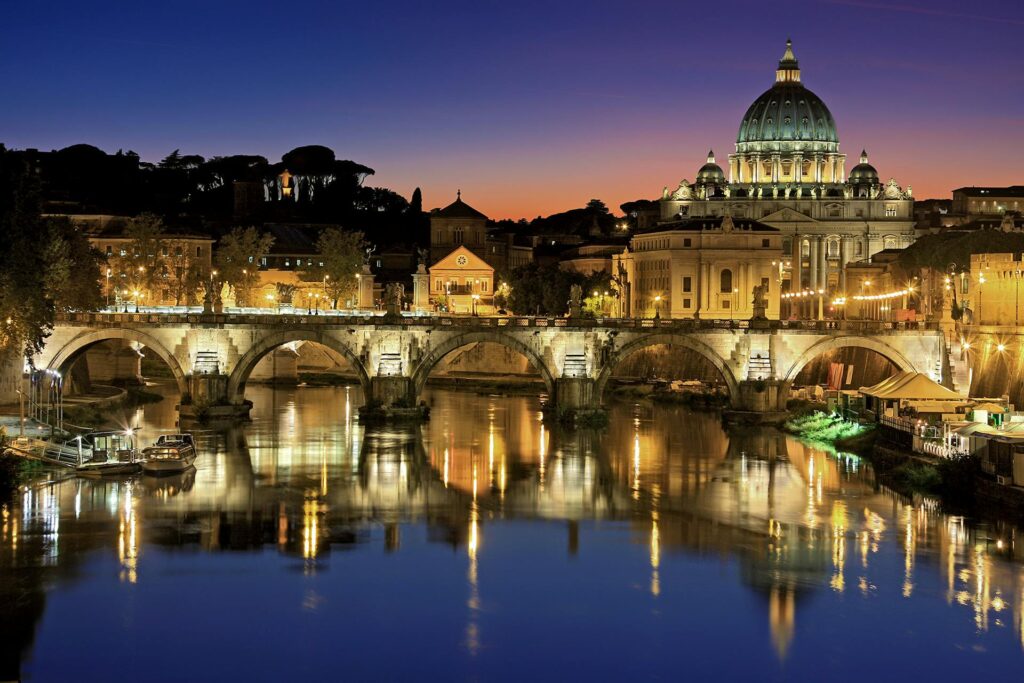 A lighted bridge in the night: one of the popular solo travel destinations in Italy