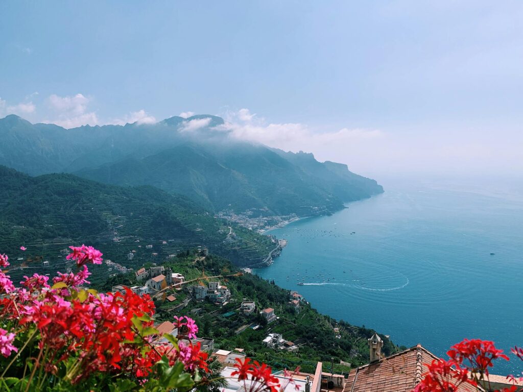 A photograph of a serene Amalfi Coast: popular solo travel destinations in Italy