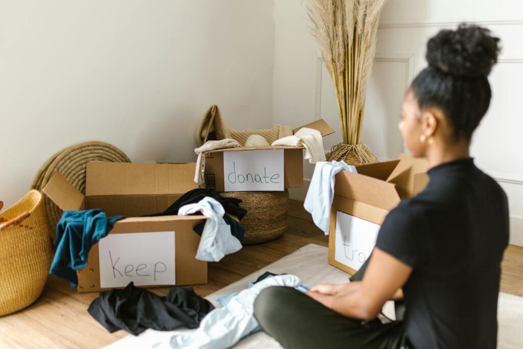 A woman decluttering her home to adopt minimal living concepts